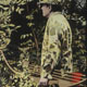 Painting of hunter in camouflage with bow